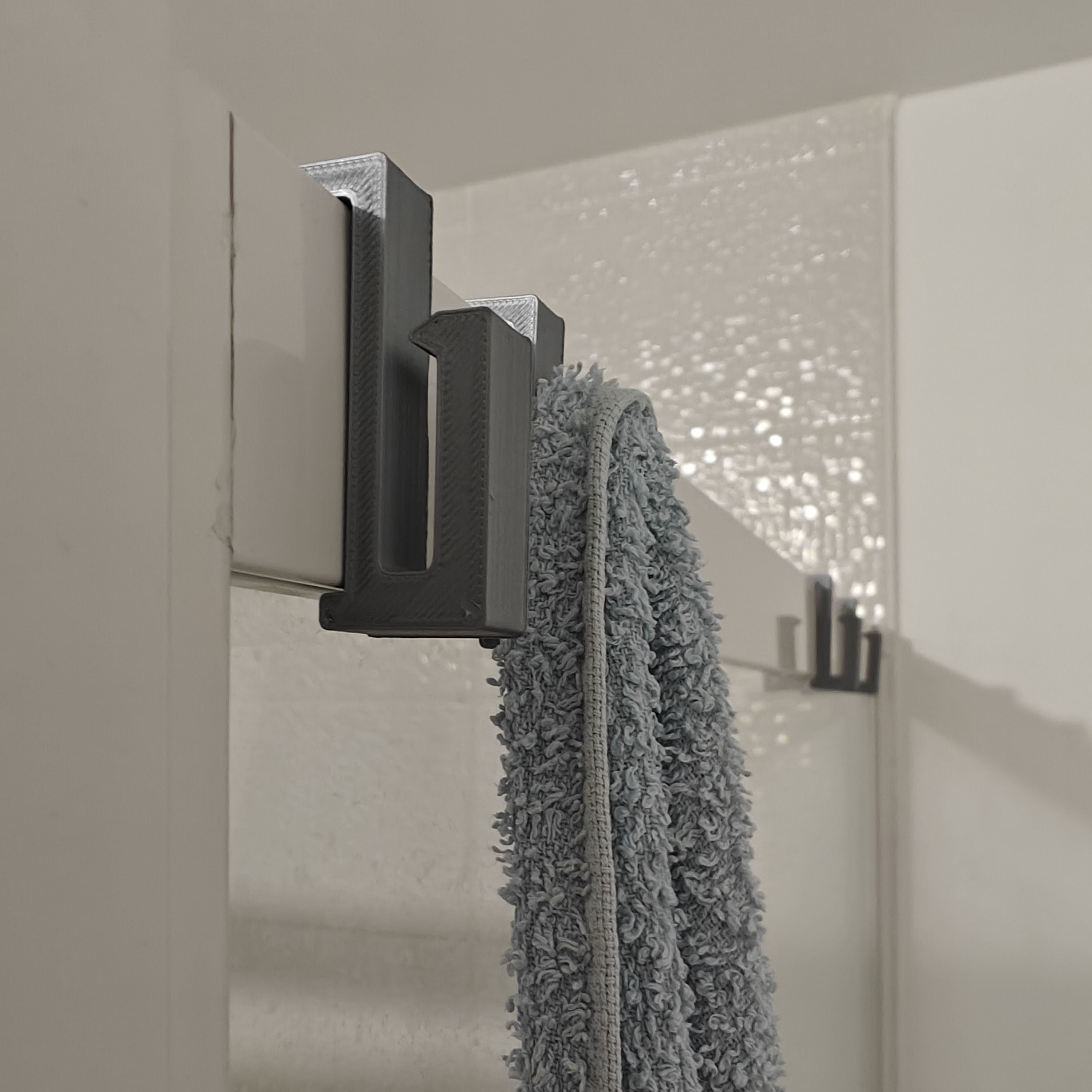 Un crochet de douche sur mesure